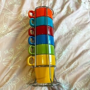 six multicolored coffee cups with a stand
